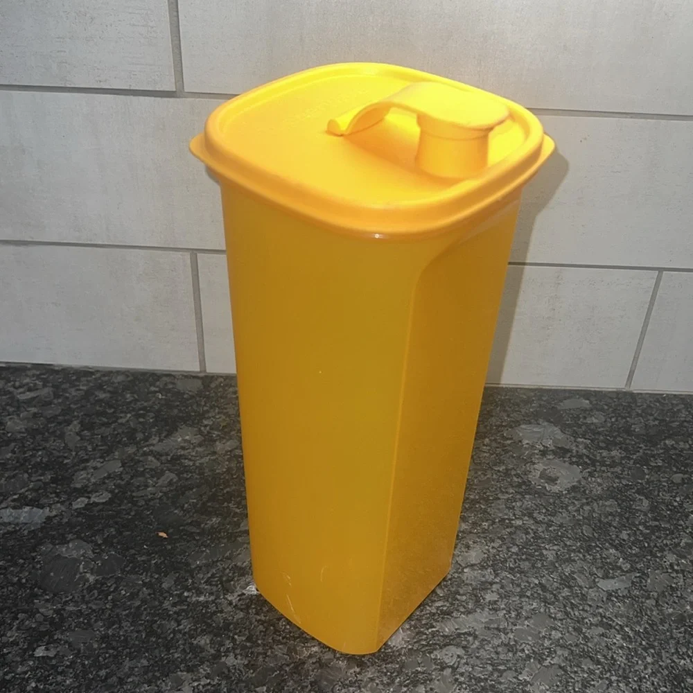 - Slim Line by Tupperware Orange Kitchen Storage Container. Looks brand new